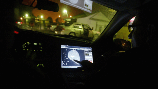 In this 2008 file photo, engineer Stephan Noetzel alerts a police officer to gunshots using ShotSpotter in East Palo Alto, Calif. Police and public officials nationwide continue to debate use of the technology.