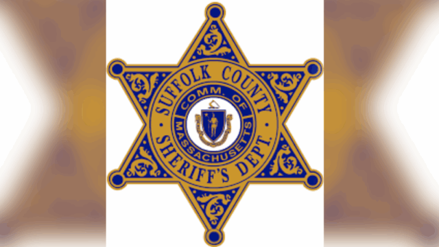 image of suffolk county sheriff department logo on blurred background