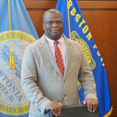 Boston Police Commissioner Michael Cox stands at a podium during a press conference. (Photo by Michael Jonas)