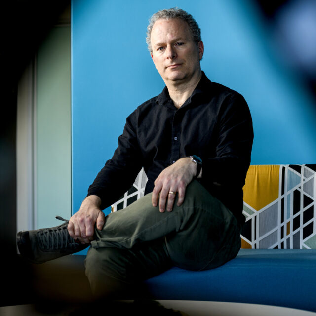 image of David Lazer, Northeastern distinguished professor of political science and computer science, poses for a portrait at 177 Huntington Ave. on Feb. 21, 2024. Photo by Matthew Modoono/Northeastern University