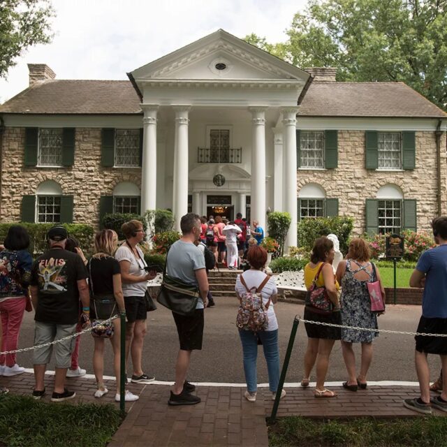 image of graceland mansion with fans outside