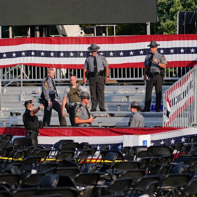 Law enforcement at the campaign rally where the attempted assassination on Trump occurred.