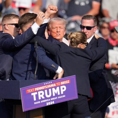 Republican presidential candidate former President Donald Trump is helped off the stage at a campaign event in Butler, Pa., on Saturday, July 13, 2024.