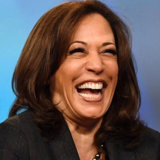 Kamala Harris laughs while speaking at the 