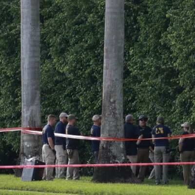 Law enforcement personnel investigate the area around Trump International Golf Club after an assassination attempt on former President Donald Trump on September 16, 2024, in West Palm Beach, Florida.