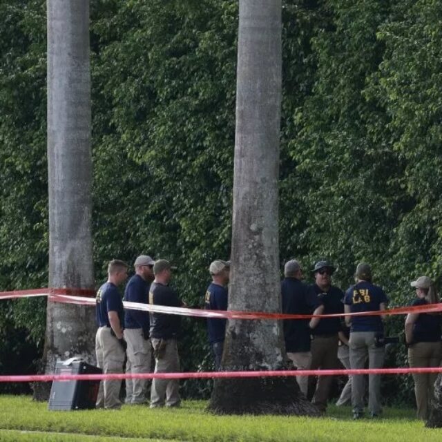 Law enforcement personnel investigate the area around Trump International Golf Club after an assassination attempt on former President Donald Trump on September 16, 2024, in West Palm Beach, Florida.