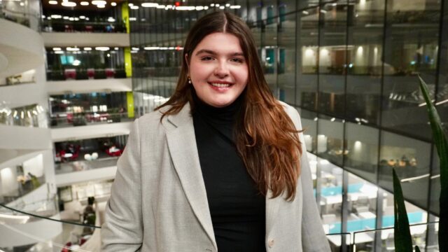 A girl smiles for a headshot in ISEC.