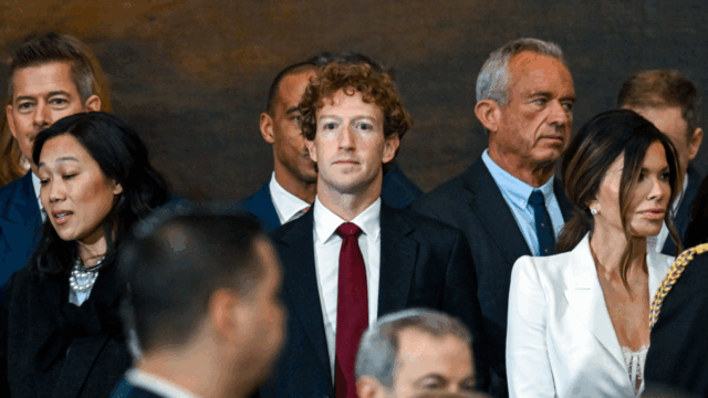Mark Zuckerberg faces forward in a crowd at the inauguration ceremony