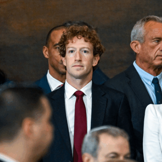 Mark Zuckerberg faces forward in a crowd at the inauguration ceremony