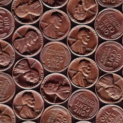 Pennies lined up in a grid formation fill the screen.