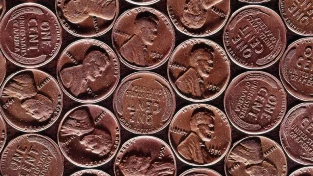 Pennies lined up in a grid formation fill the screen.
