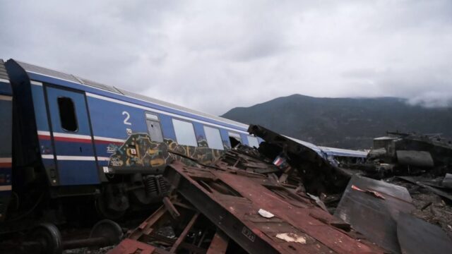 Wrecked wagons and mangled pieces of metal are seen near the tracks after a train accident in the Tempi Valley near Larissa, Greece, March 1, 2023.