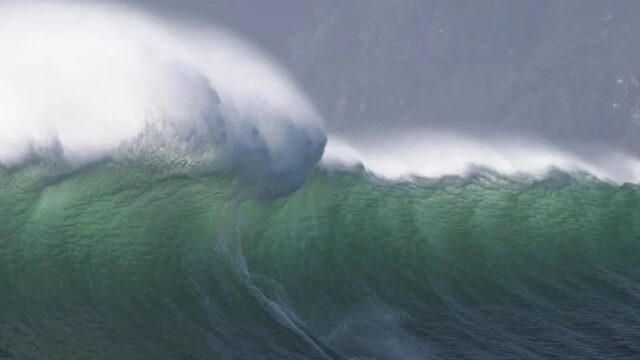 A surfer catches a wave at Sunset, an offshore surfing spot close to Hout Bay, that produces some of South Africa's biggest waves in Capetown. 2022
