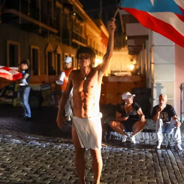 Puerto Ricans protest outside La Fortaleza during a massive blackout in Old San Juan, Puerto Rico, on April 16, 2025.