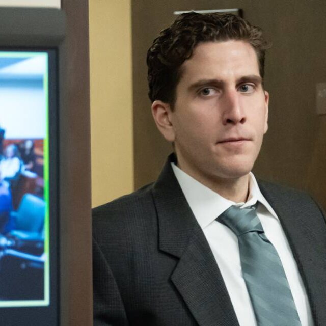 Bryan Kohberger, who is accused of killing four University of Idaho students in November 2022, walks past a video display as he enters a courtroom in Latah County for a hearing two years ago. Ted S. Warren AP/Pool