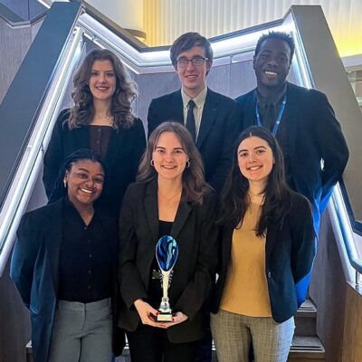 The six-person team shows off their best small delegation award at the London International Model United Nations conference.