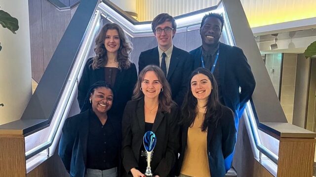 The six-person team shows off their best small delegation award at the London International Model United Nations conference.