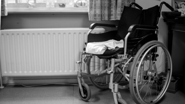 Empty wheelchair in a hospital room