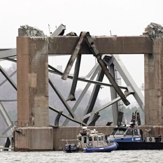 Police dive boats work around part of the structure of the Francis Scott Key Bridge after the ship hit the bridge Wednesday, March 27, 2024, in Baltimore, Md.