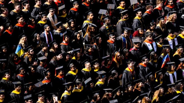 Students wear gap and gown at the commencement ceremony on May 11th.