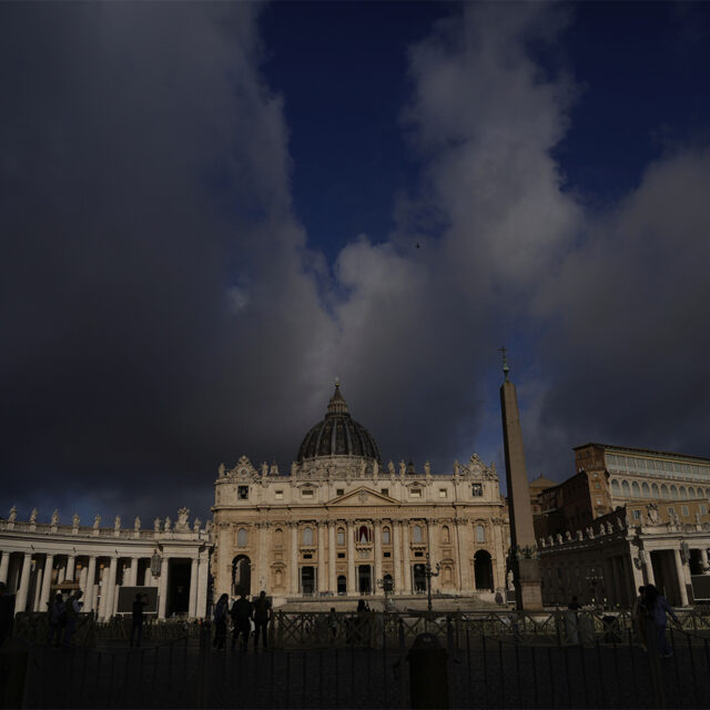 Clouds pass over the St. Peter Basilica at the Vatican, Tuesday, May 6, 2025.