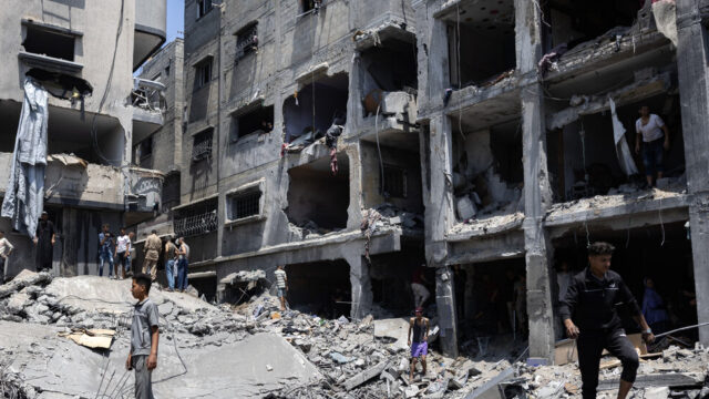 Severely damaged buildings, rubble and debris