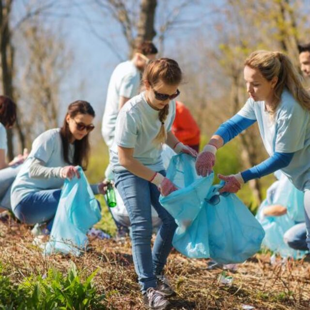 Youth picking up trash outside