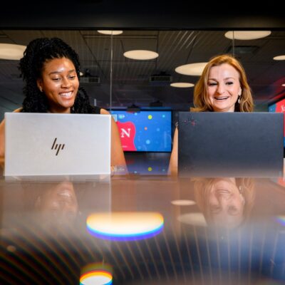 Good and Olaogun sitting at a desk together