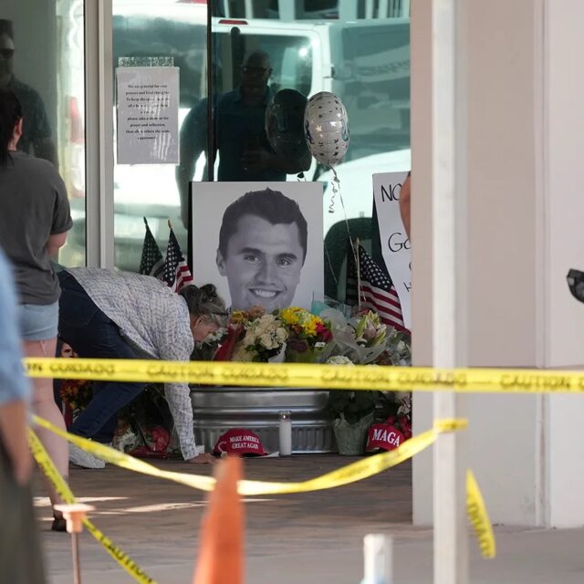 Well-wishers pay their respects at a makeshift memorial at the headquarters of Turning Point USA after the shooting death of Charlie Kirk, CEO of the organization.