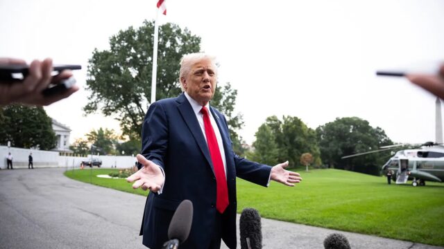 President Donald Trump speaks with reporters on the South Lawn of the White House on his way to board Marine One Sept. 30, 2025.