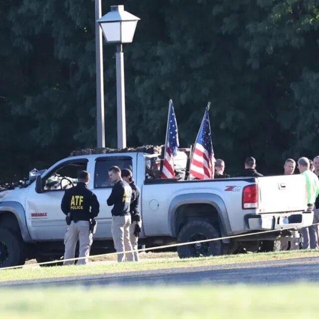ATF police stand by the vehicle used to ram the exterior of the Church of Jesus Christ of Latter-day Saints, Monday, Sept. 29, 2025 in Grand Blanc Township, Mich.