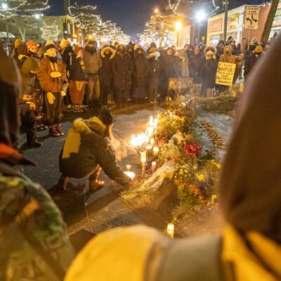 Protesters hold a vigil over the spot where federal agents killed a man in Minneapolis, United States, on January 24, 2026. (Photo by Arthur Maiorella/Anadolu via Getty Images)