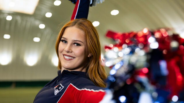 Lana Vogler, a Northeastern behavioral neuroscience and philosophy student and New England Patriots Cheerleader, shows off some of her cheerleading routine in the Carter Field Bubble on Monday, Feb. 2, 2026. Photo by Alyssa Stone/Northeastern University
