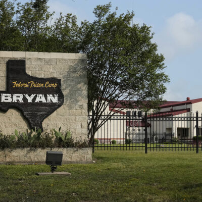 The main entrance to Federal Prison Camp, Bryan on Thursday, Aug. 7, 2025, in Bryan, Texas. (AP Photo/Ashley Landis)