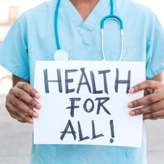 portrait of an unrecognizable African American man holding a banner that says 