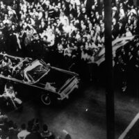 22nd November 1963: US statesman John F Kennedy, 35th president of the US, and First Lady Jacqueline Kennedy traveling in the presidential motorcade at Dallas, shortly before his assassination. (Photo by Keystone/Getty Images)