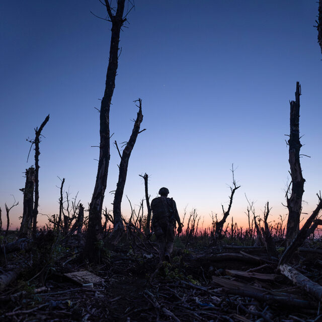 Ukrainian servicemen walk through a charred forest along the front line, a few kilometers from Andriivka, Donetsk region, Ukraine, Saturday, Sept. 16, 2023. (AP Photo/Mstyslav Chernov, File)