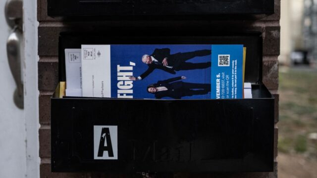 A Kamala Harris campaign pamphlet is seen in a mail box two days before election day in Philadelphia, Pennsylvania on November 3, 2024. (Photo by ANDREW CABALLERO-REYNOLDS / AFP)