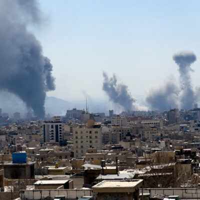 Plumes of smoke rise following reported explosions in Tehran on March 1, 2026, after Iran's supreme leader, Ayatollah Ali Khamenei, was killed a day earlier in a large U.S. and Israeli attack, prompting a new wave of retaliatory missile strikes from Iran. (Photo by Mahsa / Middle East Images / AFP via Getty Images)