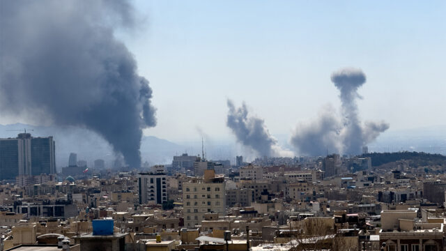 Plumes of smoke rise following reported explosions in Tehran on March 1, 2026, after Iran's supreme leader, Ayatollah Ali Khamenei, was killed a day earlier in a large U.S. and Israeli attack, prompting a new wave of retaliatory missile strikes from Iran. (Photo by Mahsa / Middle East Images / AFP via Getty Images)