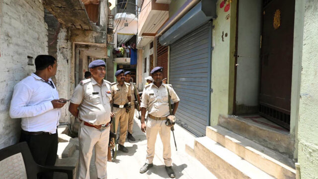 PATNA, INDIA - MAY 16: Police personnel stand guard at Jagat Villa Apartment after Bihar Economic Offences Unit (EOU) condusts raid at the residence of an executive engineer of Rural Works department Gopal Kumar in connection with alleged Rs. 2 crore disproportionate assets, on May 16, 2026 in Patna, India. (Photo by Santosh Kumar/Hindustan Times via Getty Images)