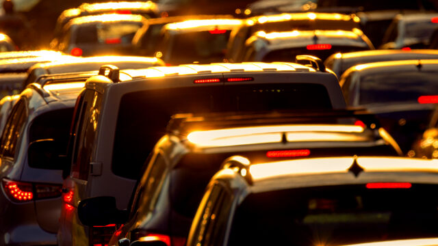 Heavy traffic jam during rush hour at sunset or dawn.