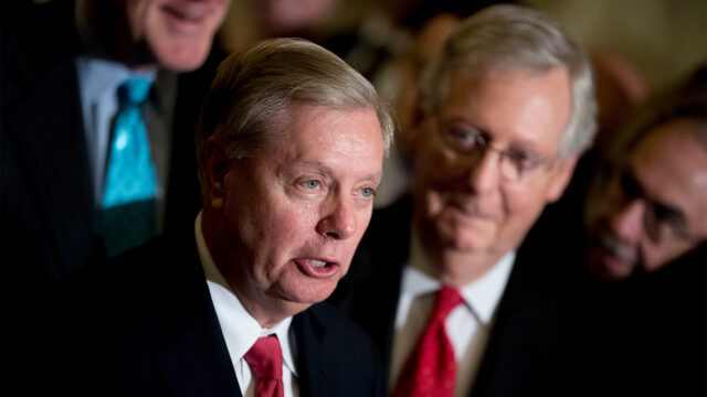 Sen. Lindsey Graham, R-S.C., flanked by Senate Majority Leader Mitch McConnell, R-Ky., right, speaks to reporters at the Capitol in Washington, Sept. 26, 2017. (AP Photo/Andrew Harnik, File)