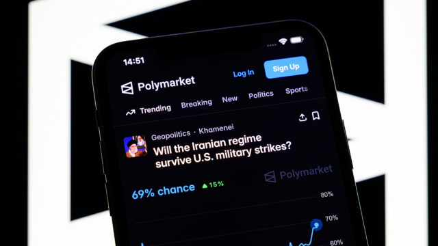 A betting page on the potential fall of the Iranian regime by June 30 appears on the Polymarket platform on a smartphone in Creteil, France, on March 9, 2026, during a massive insider trading scandal involving bets on the recent military strikes in Iran. (Photo by Samuel Boivin/NurPhoto via AP)