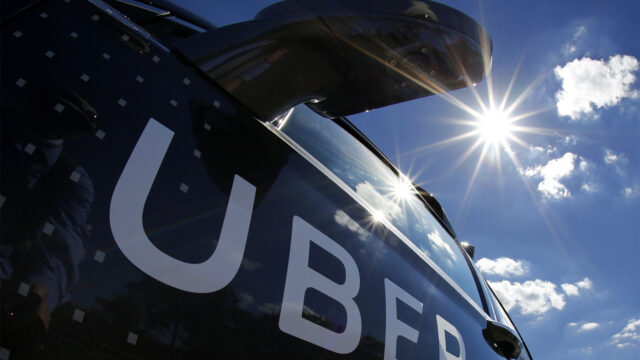 In this Monday, Sept. 12, 2016, file photo, a self-driving Uber sits ready to take journalists for a ride during a media preview in Pittsburgh. A federal criminal investigation into alleged espionage at Uber has indefinitely delayed a trial over whether the beleaguered ride-hailing service stole self-driving car technology from Waymo, a spinoff from Google. (AP Photo/Gene J. Puskar, File)