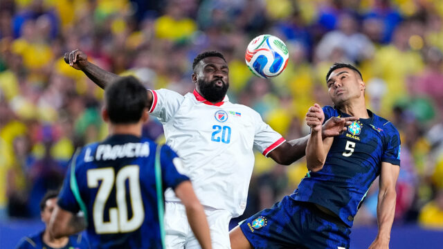 Brazil's Casemiro (5) battles for the ball with Haiti's Frantzdy Pierrot (20) during the World Cup Group C soccer match between Brazil and Haiti in Philadelphia, Friday, June 19, 2026. (AP Photo/Petr David Josek)