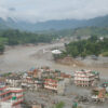 A damaged section of a highway in Nuwakot, central Nepal, is seen on August 27, 2026, following a glacial lake outburst in Tibet. Rescue teams collect bodies, while residents displaced by the flooding shelter in elevated areas. The flooding has damaged roads and disrupted transportation in the region. (Photo by Sanjit Pariyar/NurPhoto via AP)