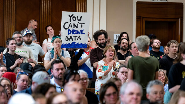 Hundreds attend a Town of Tonawanda Planning Board meeting in Kenmore, N.Y. Wednesday, June 3, 2026, as they expressed vocal and at times boisterous opposition about a proposed data center on the site of the now closed Tonawanda Coke facility. Attendees spoke of the environmental damage created by the former coke plant, and a legacy of pollution endured by people in Western New York, rebuking the project as a return to problems created by past industries. (Photo by Craig Ruttle/Sipa USA)(Sipa via AP Images)
