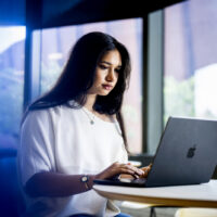 10/20/26 - BOSTON, MA. - Kayla Ruggiero, who studies Political science and international affairs, works on a laptop inside the EXP building on Oct. 20, 2026. Ruggiero recently completed a co-op at the Scottish Parliament. Photo by Matthew Modoono/Northeastern University
