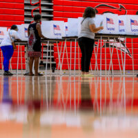 People vote in the primary election at Oak Park High School in Oak Park, Mich., Tuesday, Aug. 4, 2026, (AP Photo/Nic Antaya)